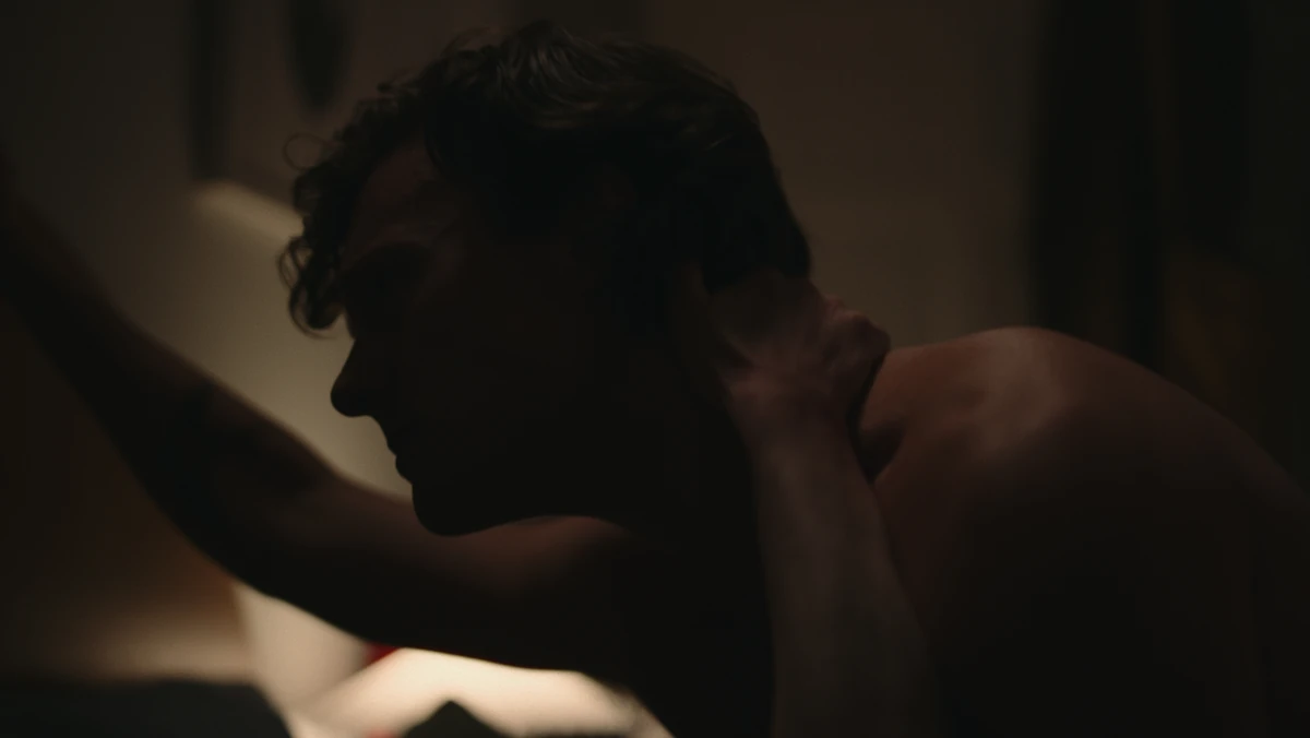 Close in the dark, a hand at his neck.